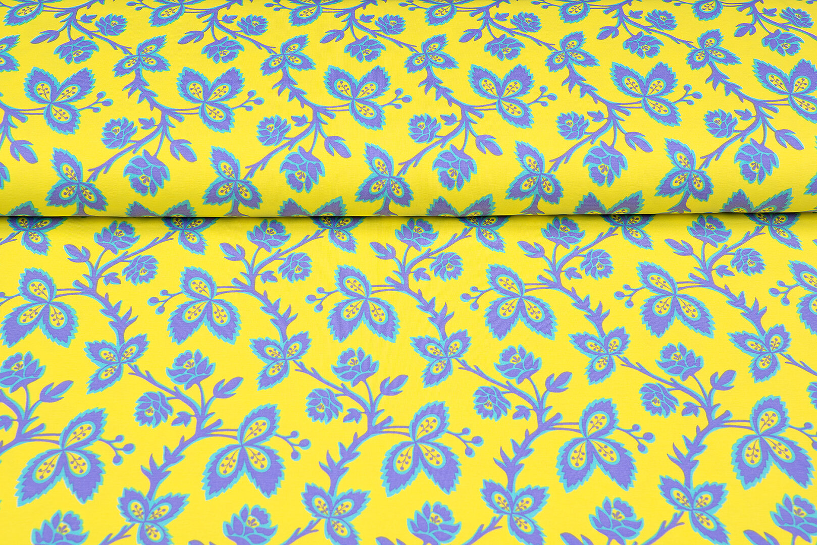 Katoenen Tricot bedrukt flowers geel-paars