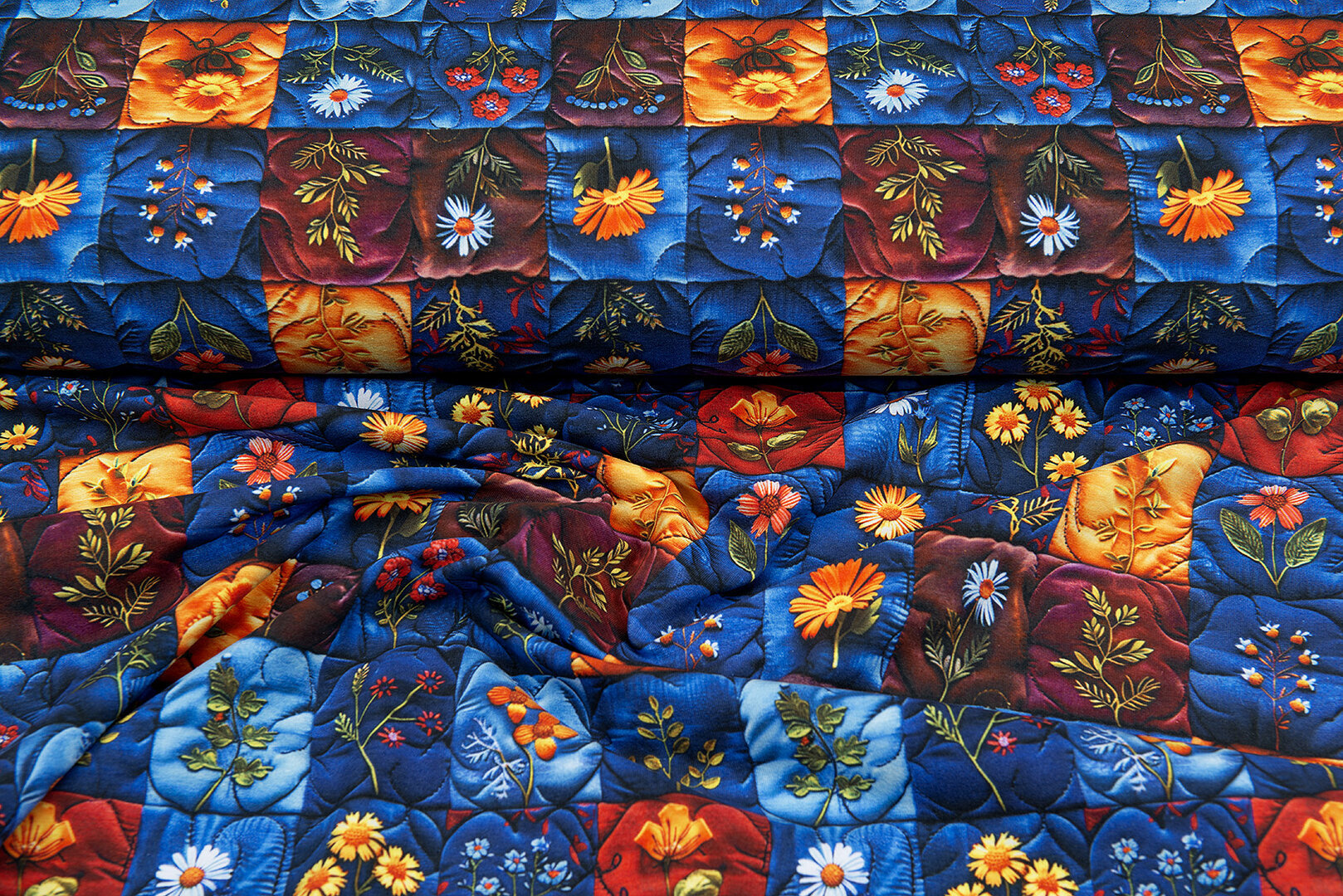 Katoenen Tricot digitaal bedrukt embroidered flower blauw-oranje