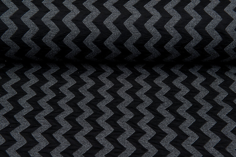 Gebreide stof zigzag zwart-grijs