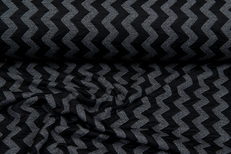 Gebreide stof zigzag zwart-grijs