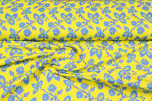 Katoenen Tricot bedrukt flowers geel-paars