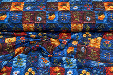 Katoenen Tricot digitaal bedrukt embroidered flower blauw-oranje